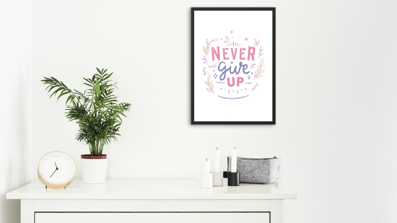 A framed quote and small plant add personal touches that change the mood of a room